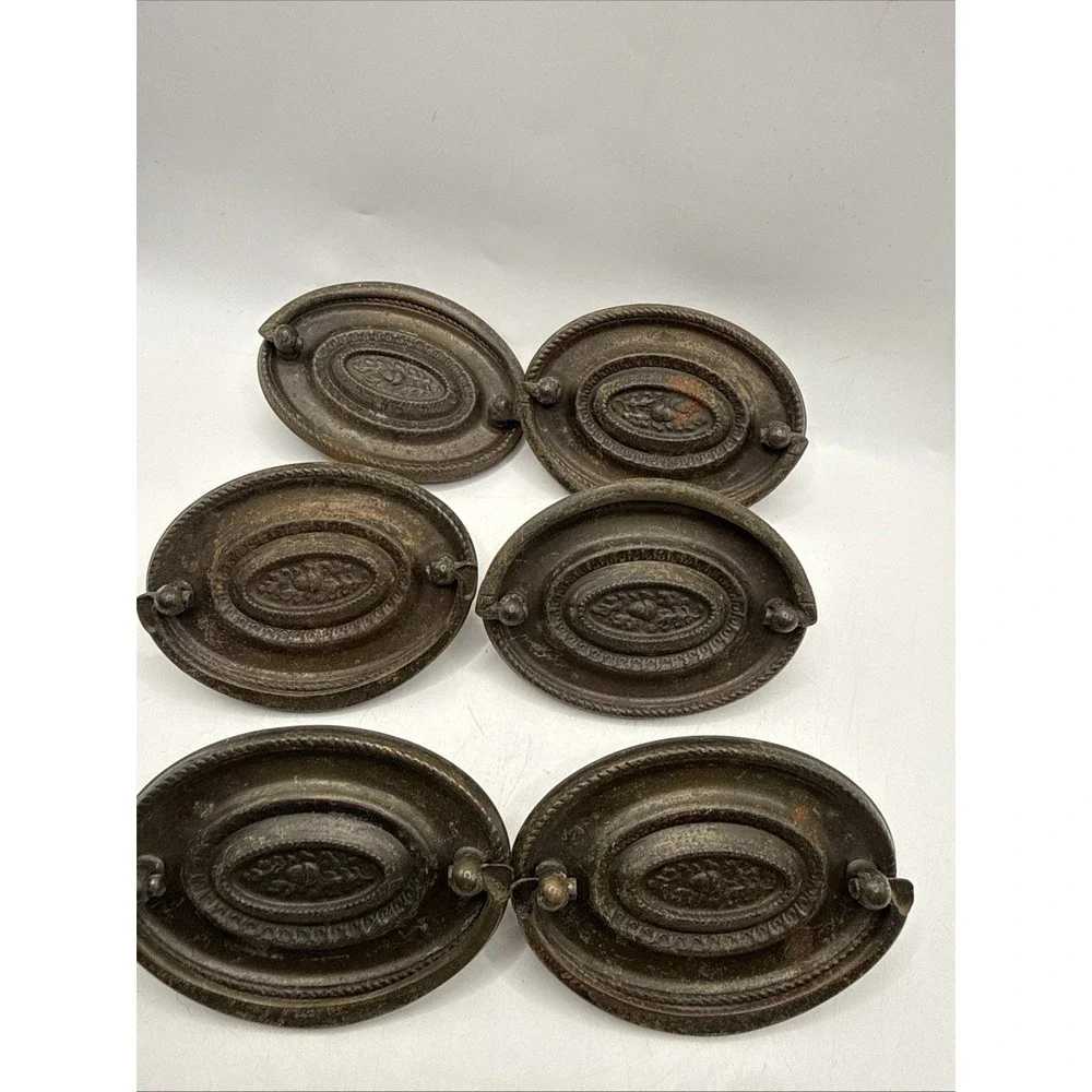 Antique Hepplewhite-style drawer pulls embossed oval backplate
